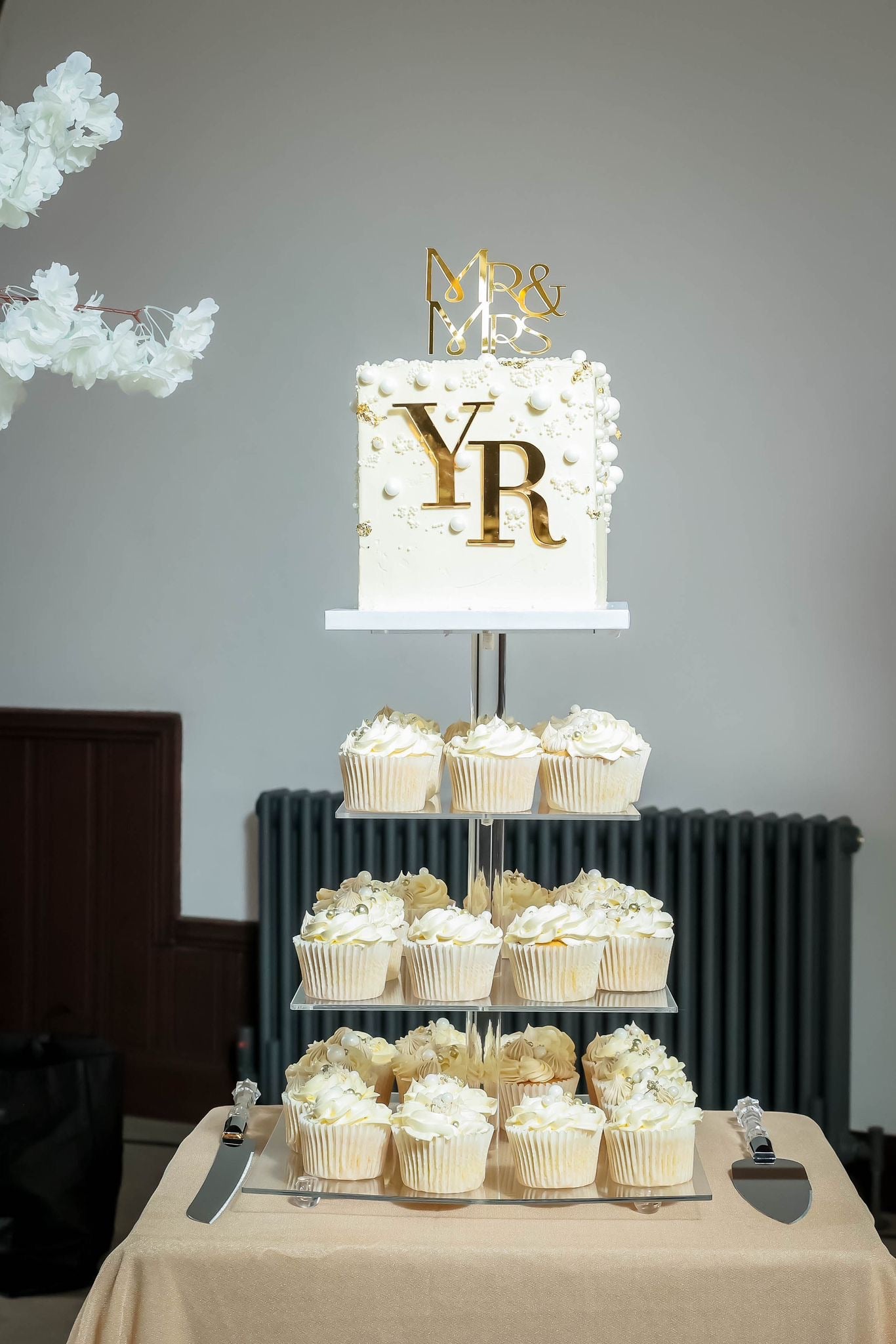 Elegant White & Gold Wedding Cake with Cupcake Tower