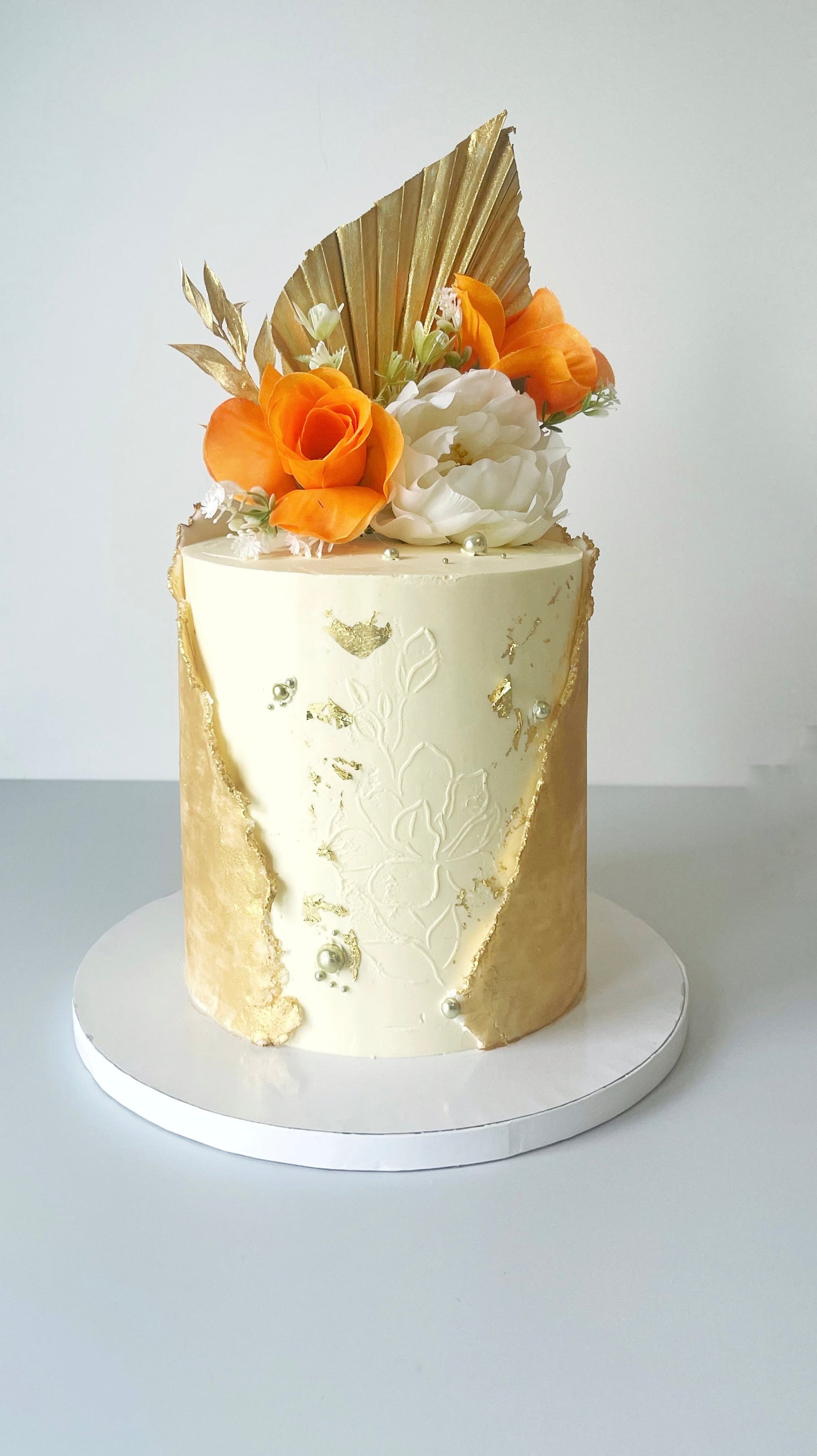 Luxurious Gold Wrap Birthday Cake with Florals